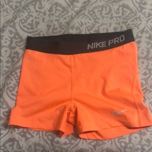 neon orange nike pros